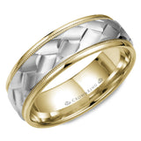 A yellow gold wedding band with milgrain detailing and a carved white gold center .