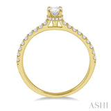 1/2 Ctw Round Cut Diamond Engagement Ring With 1/4 Ct Oval Cut Center Stone in 14K Yellow Gold