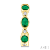 4X3 MM Oval Shape Emerald and 1/20 Ctw Bezel Set Round Cut Diamond Fashion Hoop Earrings in 10K Yellow Gold
