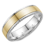 A wedding band in white gold with a yellow gold center and rope detailing.