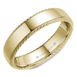 A wedding band in yellow gold with a polished finish and rope detailing. 