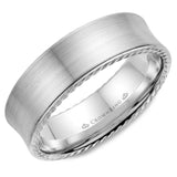 A wedding band in white gold with brushed finish and rope detailing.