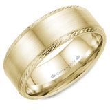 A wedding band in yellow gold with a brushed center and rope detailing on the edges.