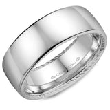 A wedding band with a polished finish and hidden rope detailing.