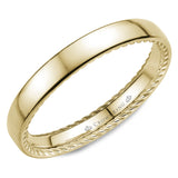 A wedding band in yellow gold with hidden rope detailing.