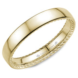 A wedding band in yellow gold with hidden rope detailing.