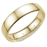 A wedding band in yellow gold with hidden rope detailing.