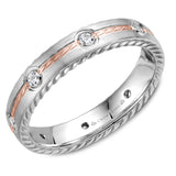 A wedding band in white gold with rope detaining on the sides, a rose gold rope detailed center and 6 round diamonds.