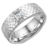 A wedding band in white gold with hammered finish, princess cut diamond and rope detailing on the sides.