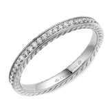 A wedding band in white gold with 29 round diamonds and rope detailing.