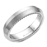 A wedding band in white gold with a knife edge and hidden rope detailing. 