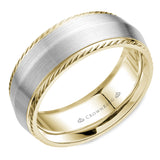 A wedding band in white and yellow gold with a knife edge and milgrain detailing. 