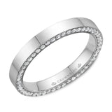 A stylish polished wedding band in white gold with 96 round diamonds on the sides. 