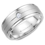 A white gold wedding band with a sandblast center and a round diamond.