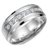 A wedding band with nine round diamonds and milgrain detailing.