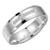 A wedding band in white gold with a brushed center, featuring nine diamonds and beveled edges.