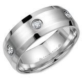 A white gold wedding band with beveled edges and a brushed center featuring six diamonds in a bezel setting.