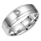 A white gold wedding band with a round diamond.