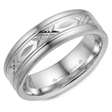 A white gold wedding band with a patterned center.