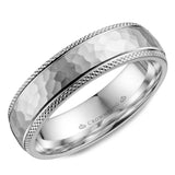 A white gold wedding band with a hammered center and textured edges.