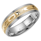 A white gold wedding band with a patterned yellow gold center.