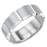 A white gold wedding band with carved detailing. 