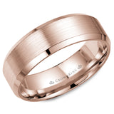 A rose gold wedding band with a brushed center and beveled edges. 