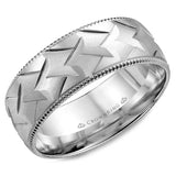 A white gold wedding band with a patterned center and milgrain detailing.