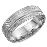 A white gold wedding band with a bark finish and mailgrain detailing.