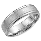 A white gold wedding band with a textured center and milgrain detailing.