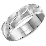 A wedding band with a brushed center and line detailing.