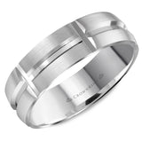 A brushed white gold wedding band with line detailing. 