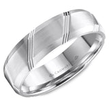 A brushed white gold wedding band with beveled edges and line detailing.