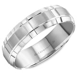 A white gold wedding band with a brushed center and intricate line detailing.