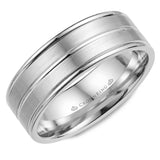 A white gold wedding band with line detailing.