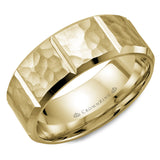 A yellow gold wedding band with a hammered finish and notch detailing.