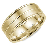 A brushed yellow gold wedding band with polished line detailing.