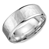 A white gold wedding band with a hammered center. 