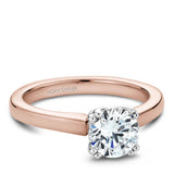 A Noam Carver rose and white gold engagement ring with a round centerpiece.