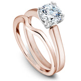A Noam Carver rose and white gold engagement ring with a round centerpiece.