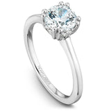A Noam Carver white gold engagement ring with a round centerpiece and 8 diamonds.