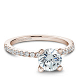 A Noam Carver rose gold engagement ring with 18 diamonds.