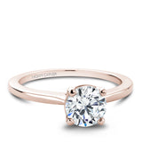 A Noam Carver rose gold engagement ring with a round centerpeice.