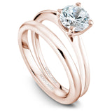 A Noam Carver rose gold engagement ring with a round centerpeice.