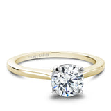 A Noam Carver yellow and white gold engagement ring with a round centerpiece.