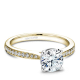 A Noam Carver yellow and white gold engagement ring with 22 diamonds.