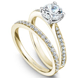 A Noam Carver yellow and white gold engagement ring with 22 diamonds.