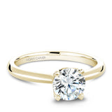 A Noam Carver yellow gold engagement ring with a round centerpiece and 32 diamonds.