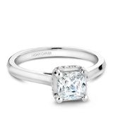 A Noam Carver white gold engagement ring with a princess cut centerpiece and 20 diamonds.
