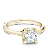 A Noam Carver yellow gold engagement ring with a princess cut centerpiece and 20 diamonds.
